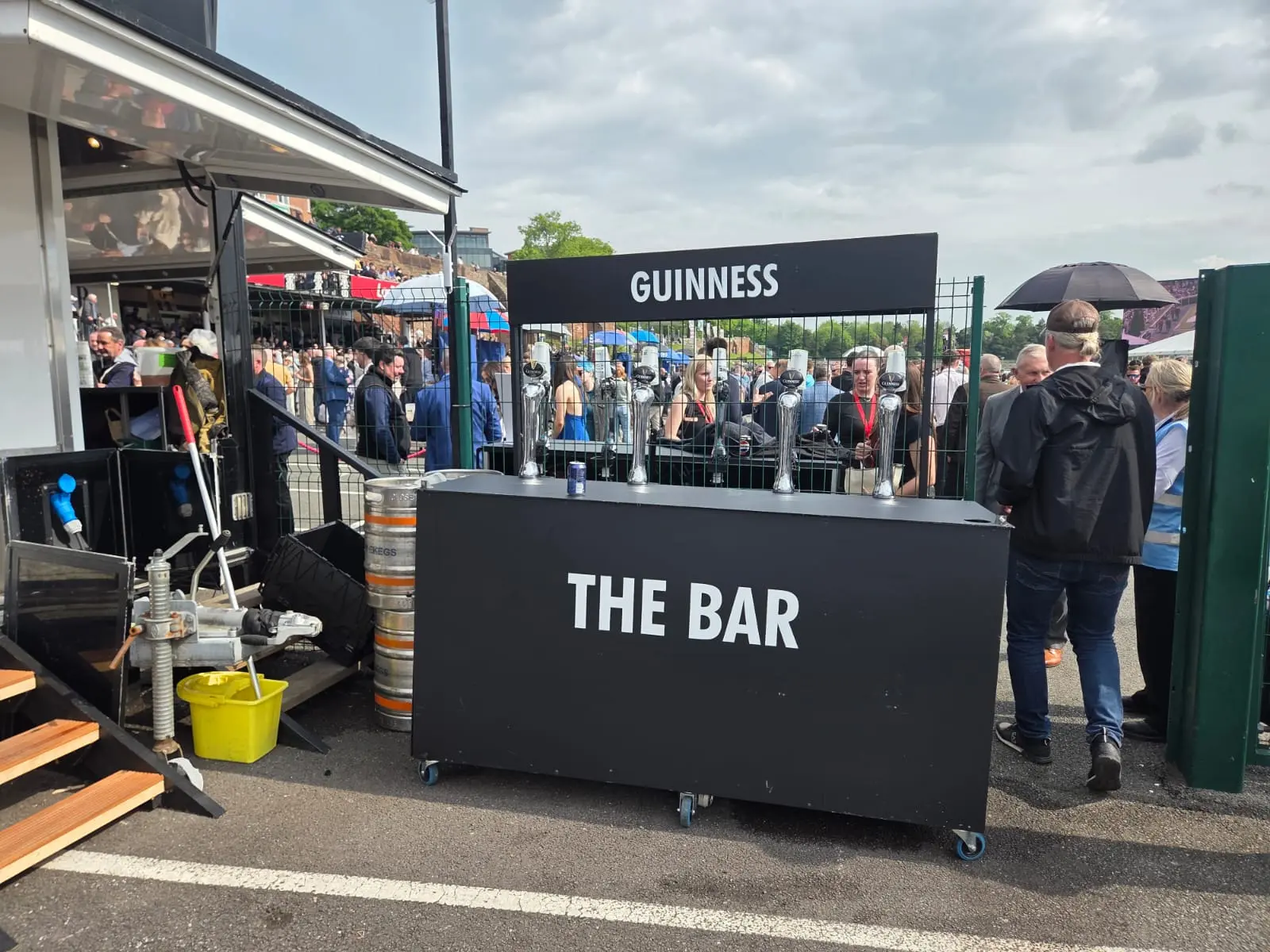 Guinness draught bar serving a busy outdoor crowd