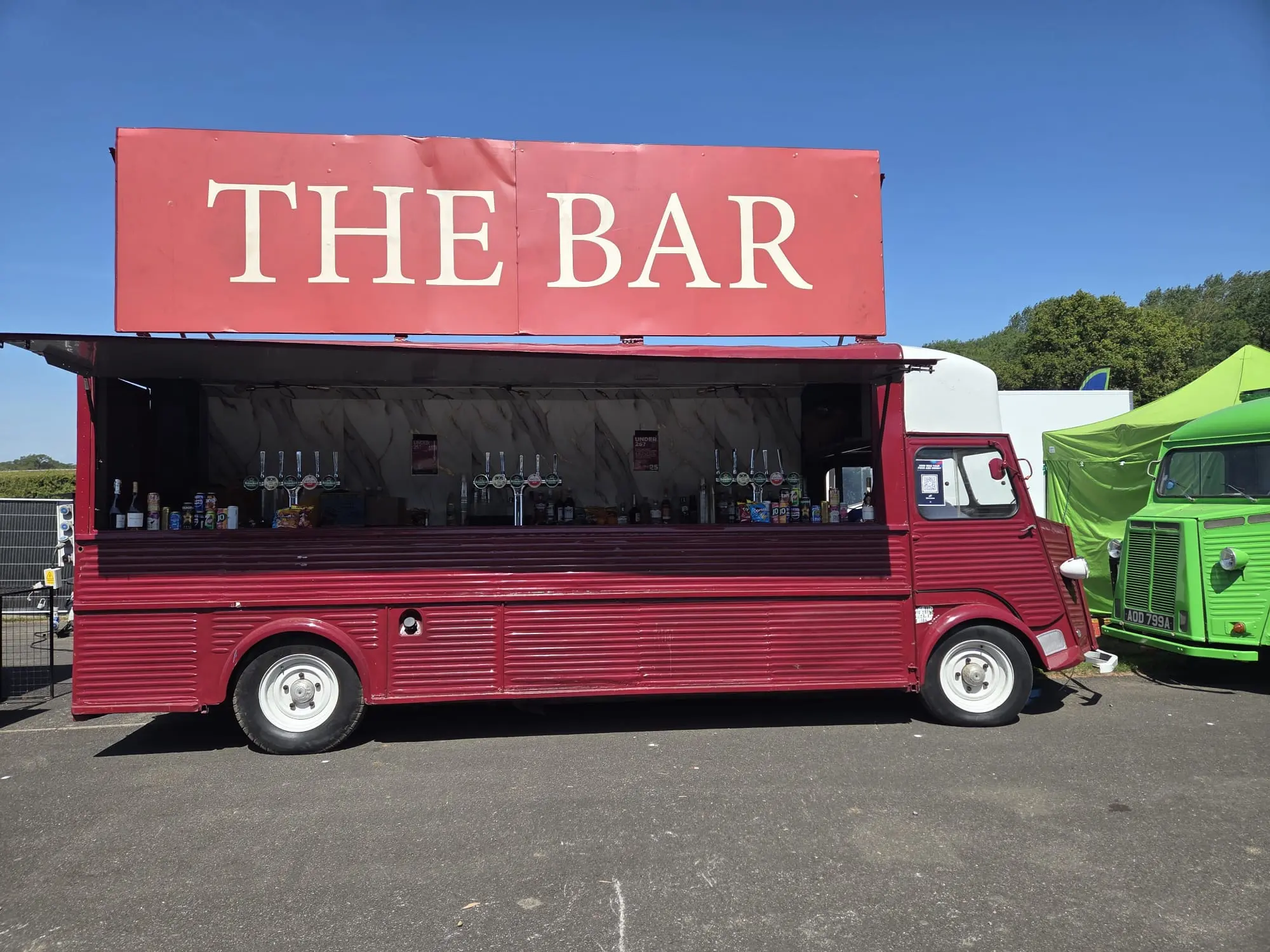 Large burgundy mobile event bar with multiple draught taps